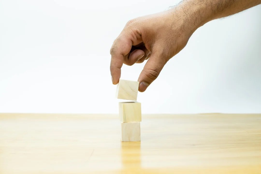 Scrabble tiles spelling SEO Audit on wooden surface, symbolizing digital marketing strategies.